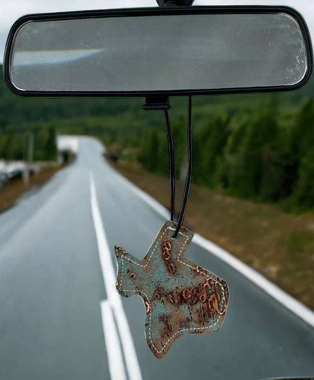 Texas-shaped hair-on-hide and leather car freshener charm, stitched design