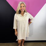 Taupe striped collared shirt dress with button front, chest pocket, and three-quarter sleeves