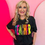 Black leopard teacher graphic tee with neon lettering, glitter accents, and colorful animal print details