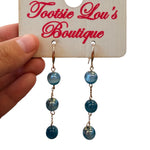 Teal marbled bead drop earrings with glossy finish and gold-tone hooks.
