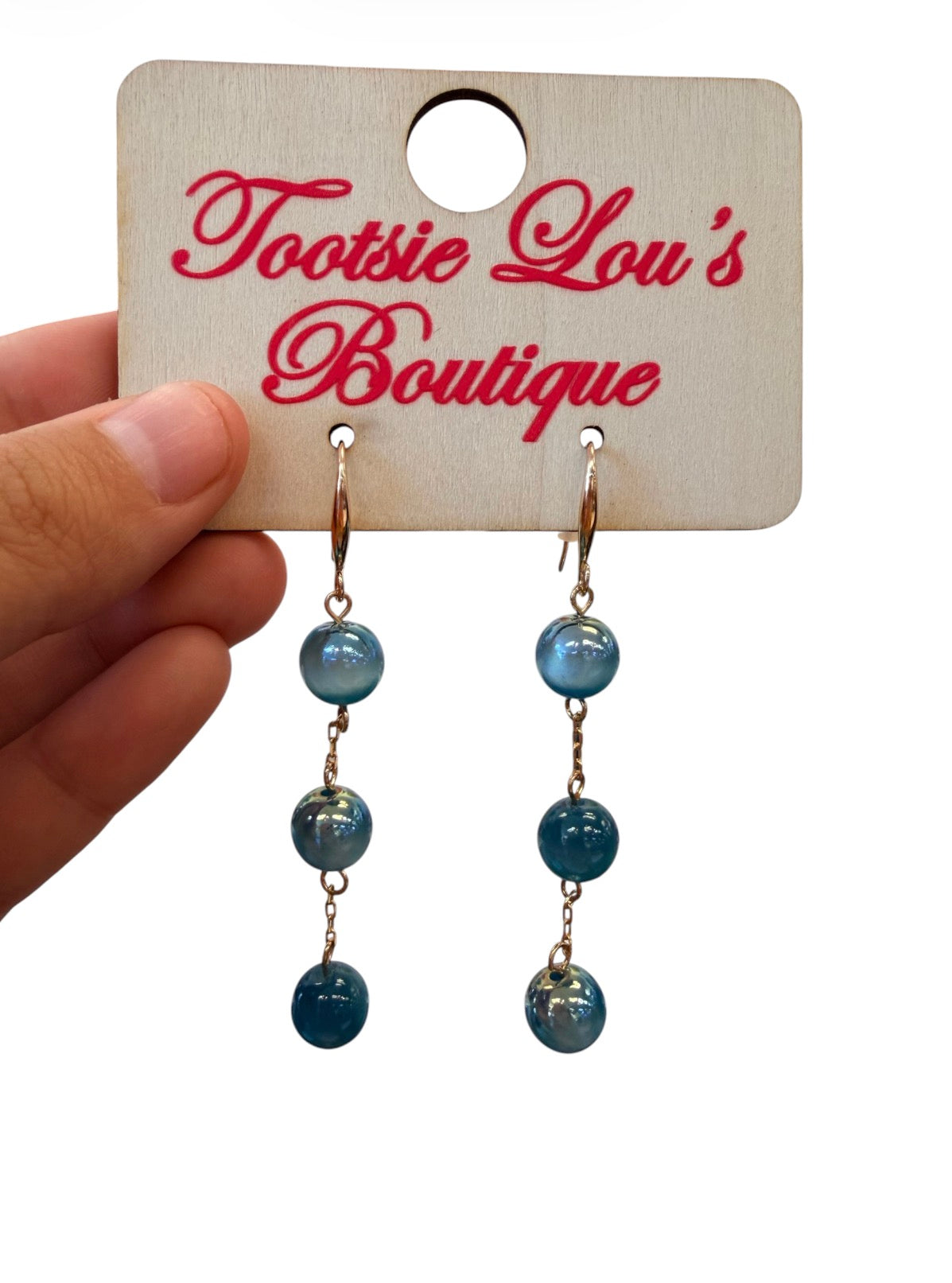 Teal marbled bead drop earrings with glossy finish and gold-tone hooks.
