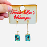 Teal Drop Earrings with gold-tone hooks and iridescent rectangular teal/blue gemstones