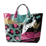 Teal hot pink leopard color block PVC tote bag with heart graphic.