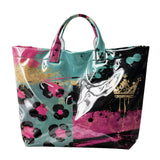 Teal hot pink leopard color block PVC tote bag with heart graphic.