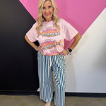 Teal and white vertical striped wide leg pants with drawstring waist and pockets.