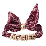 Texas A&M bandana slider bracelet with gold AGGIES letter charms and adjustable fabric band.