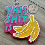 Pink glitter freshie with turquoise and hot pink lettering and yellow banana graphic.