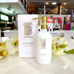 Thomas Blonde Joshua Tree hand soap in white glass bottle with gold pump.