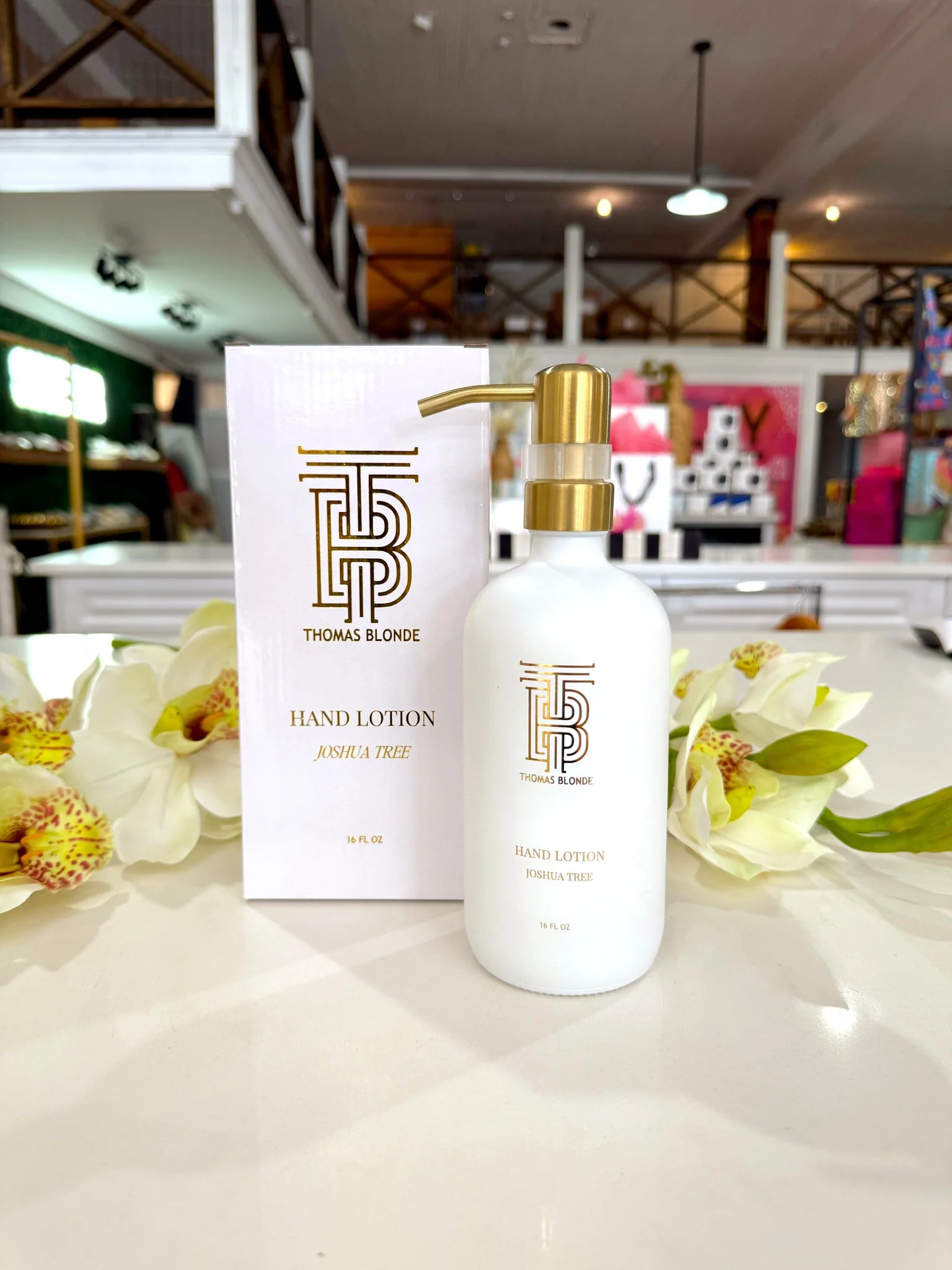 Thomas Blonde Joshua Tree hand soap in white glass bottle with gold pump.