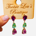 Gold-tone drop earrings with pink, aqua, and fuchsia faceted gemstones in a trio design.