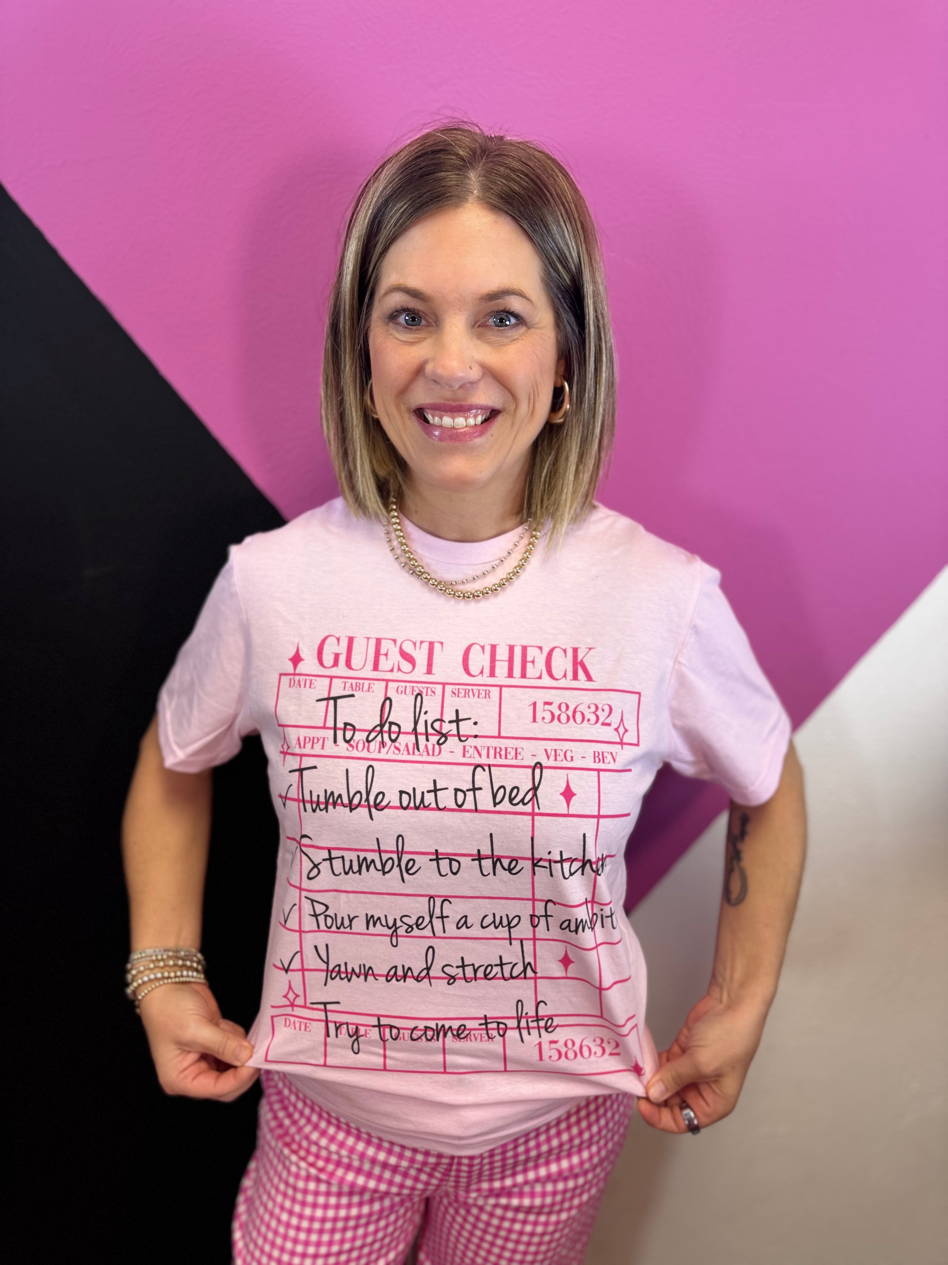 Light pink To Do List tee with guest check graphic and black handwritten-style lettering.
