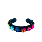 Smutt-plated cuff bracelet with sparkling crystal accents and flexible design.