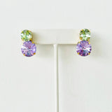 Tova violet crystal earrings with a brass base and sparkling statement design.