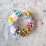 Pastel stretch bracelet with multicolored beads and crystal accents.