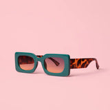 Green rectangular sunglasses with bold frame and modern design
