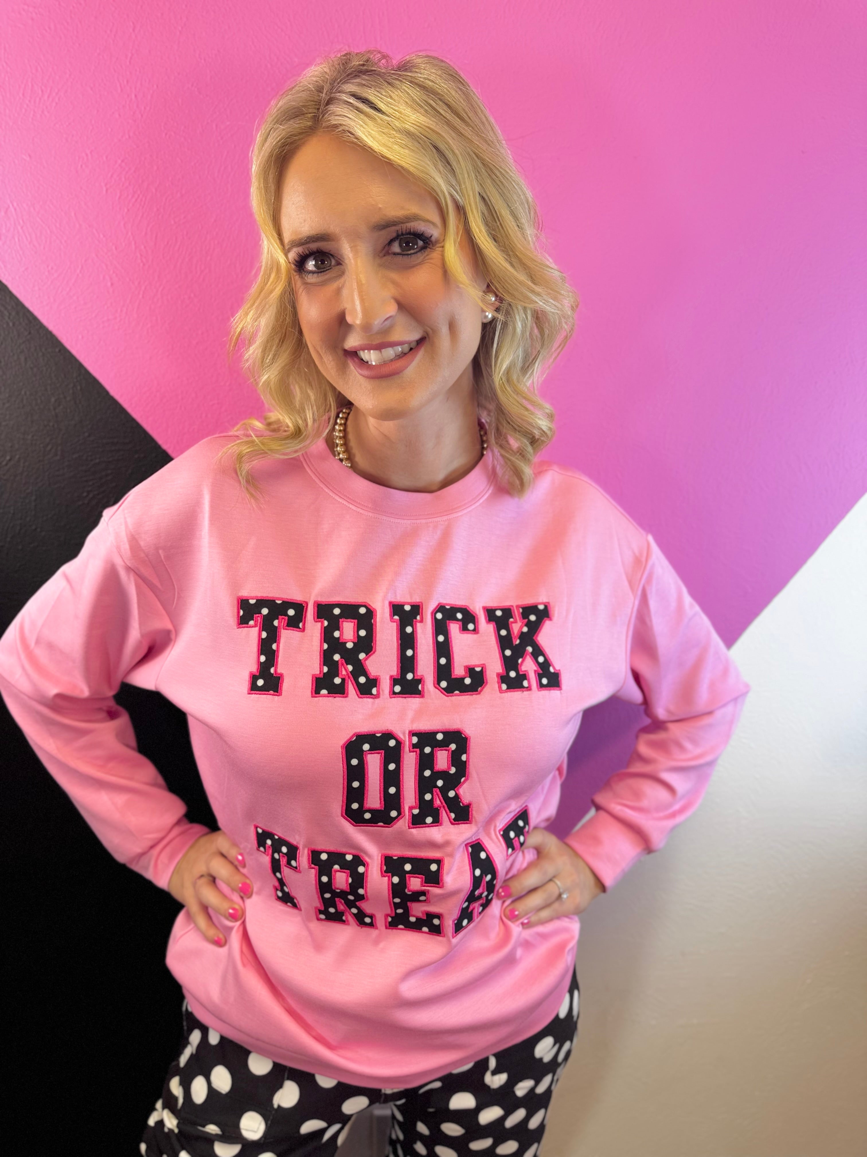Halloween pullover with bold Trick Or Treat lettering and playful polka dot patch details.