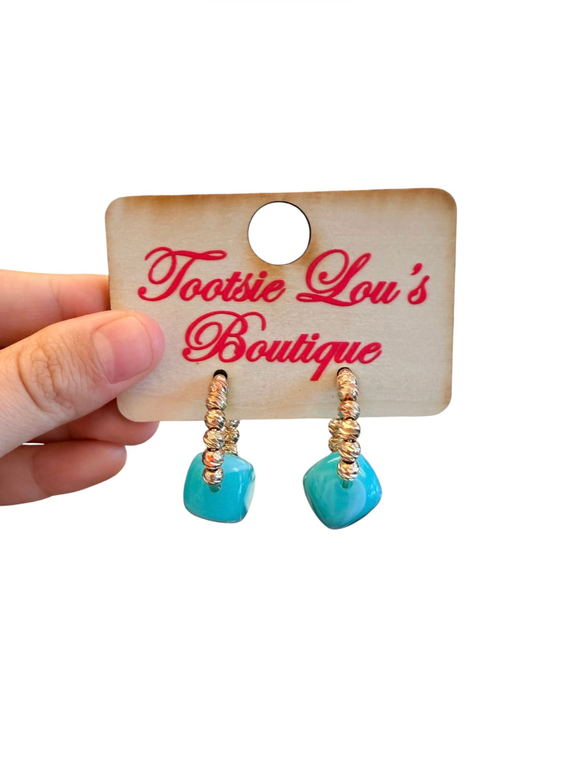 Gold beaded hoop earrings with glossy turquoise resin cube accents.