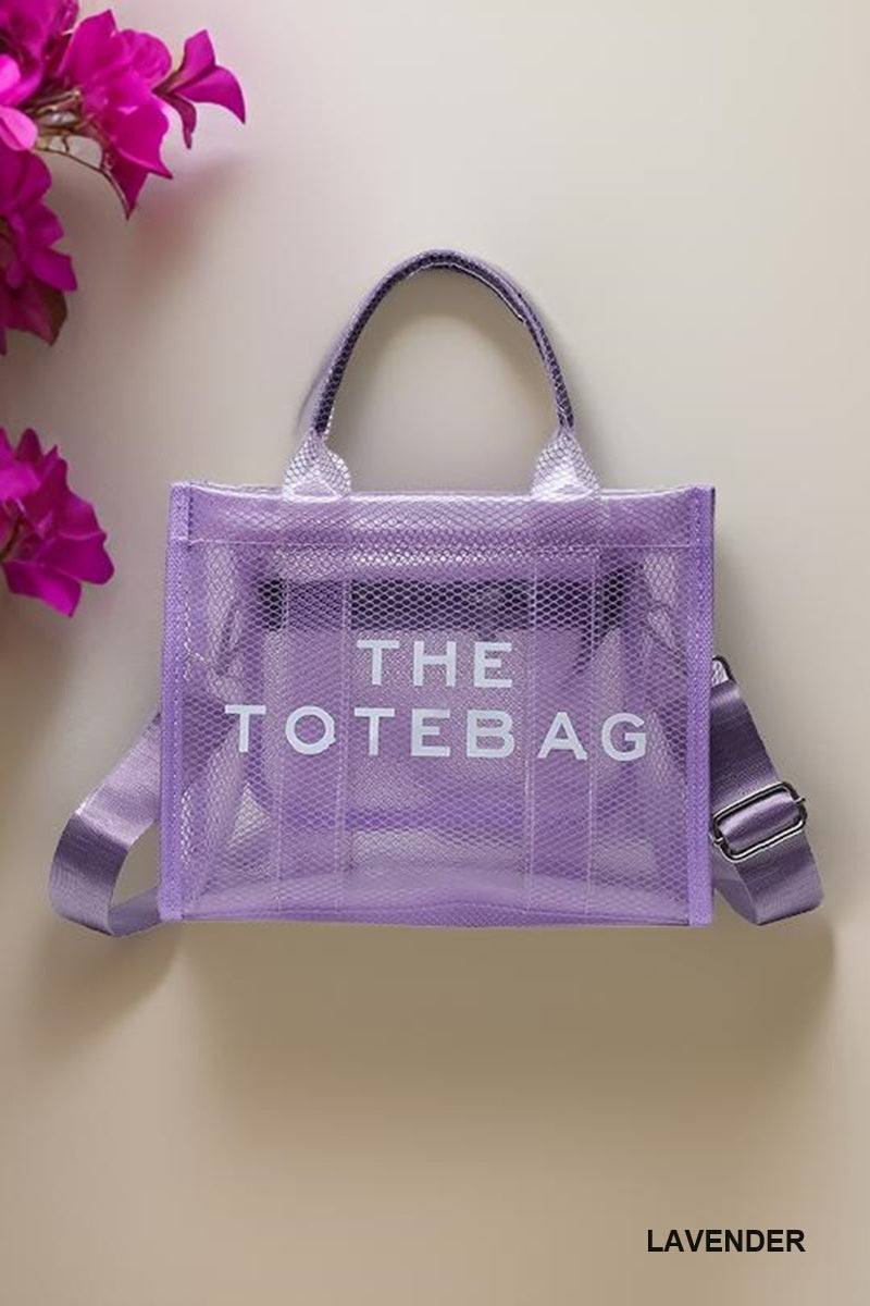 A purple, transparent tote bag with 'THE TOTE BAG' text printed on it.