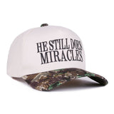He Still Does Miracles Camo Cap