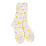 A pair of plush, soft cream-colored crew socks with a repeating pattern of bright yellow fried eggs and tiny purple flowers.