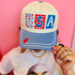 USA patchwork hat with blue bill, star details, and red snapback.