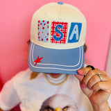USA patchwork hat with blue bill, star details, and red snapback.