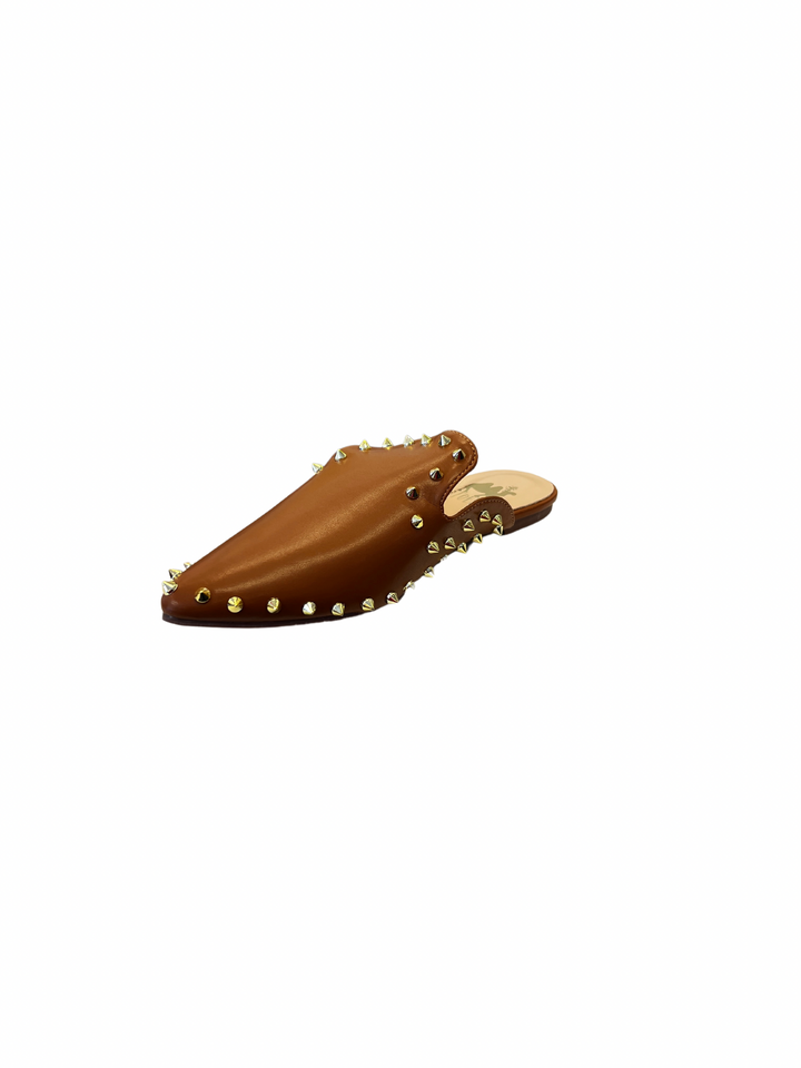 Camel-colored slide sandals with sleek silhouette and spikey stud embellishments along the edge