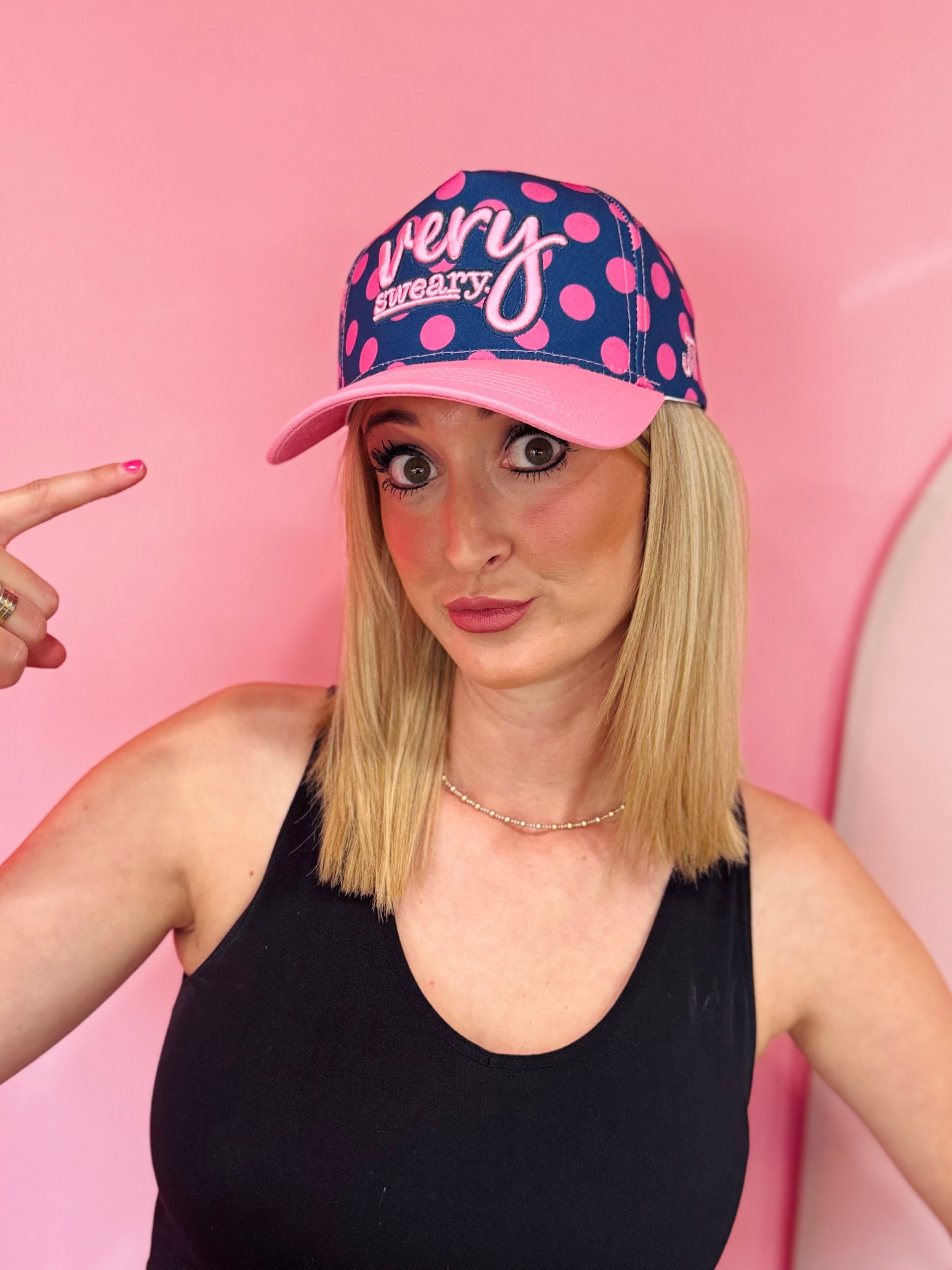 Navy blue Very Sweary embroidered cap with pink polka dots and snapback closure.