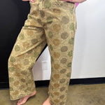 Vintage olive barrel jeans with oversized polka dots, smocked waist, and rolled cuffs.