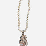 Ivory pearl necklace with vintage-style Santa pendant.