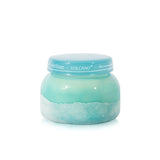 Capri Blue Volcano Luce d'Amalfi candle in turquoise textured sea glass vessel.