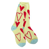A pair of plush, soft yellow crew socks with a repeating all-over pattern of bold red hearts.