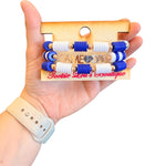 Blue and white Game Day bracelet stack with gold charm accents.