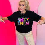Black graphic tee with neon applique and turquoise embroidery text