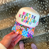 Cream multicolor “What’s the Best That Could Happen” trucker hat with patchwork bill and star embroidery.
