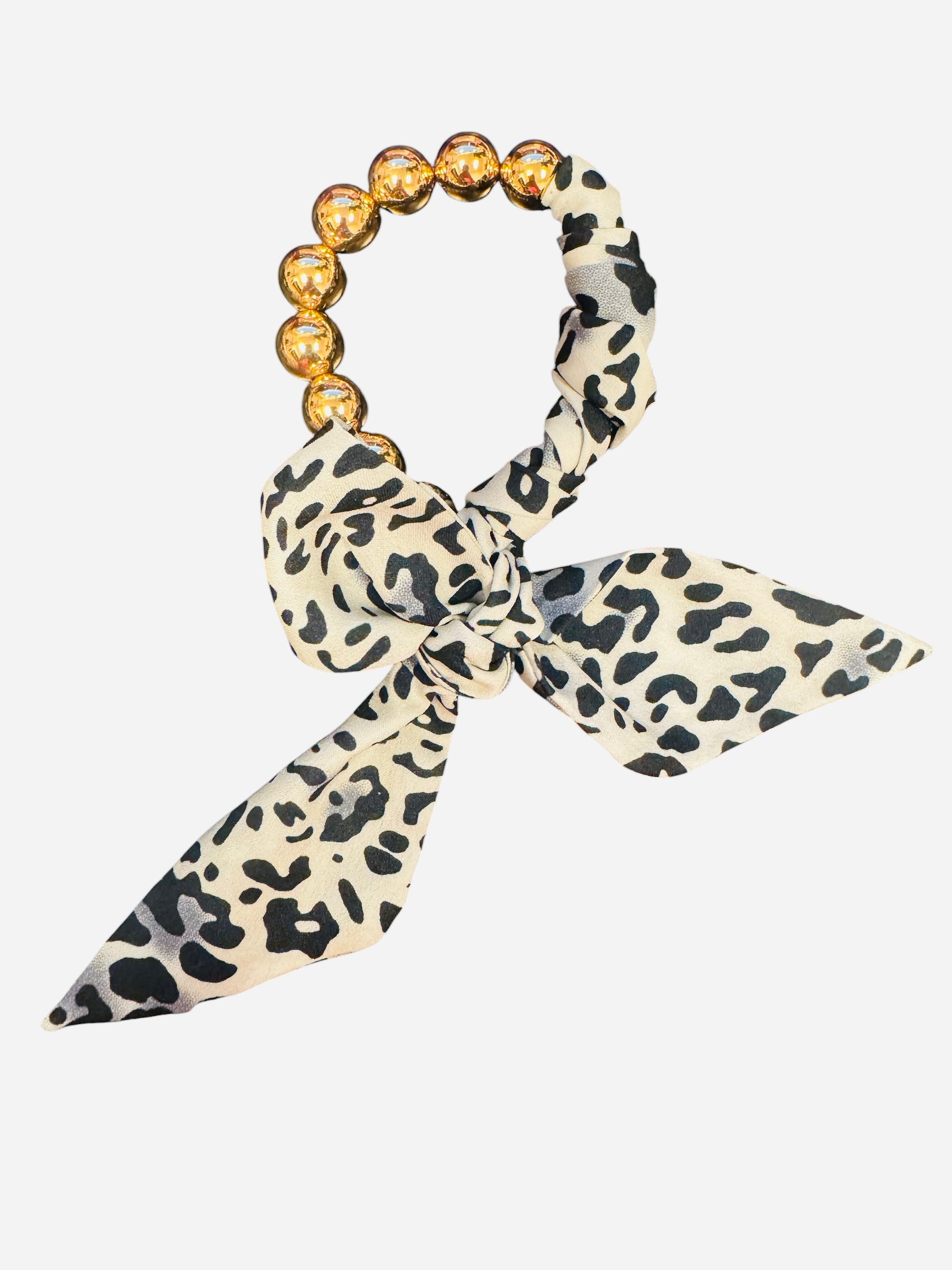 White and black animal print scarf bracelet with oversized gold water-resistant beads.