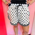 White polka dot shorts with gingham ruffle trim and elastic drawstring waistband