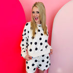 White polka dot long sleeve top and shorts lounge set with elastic waistband.