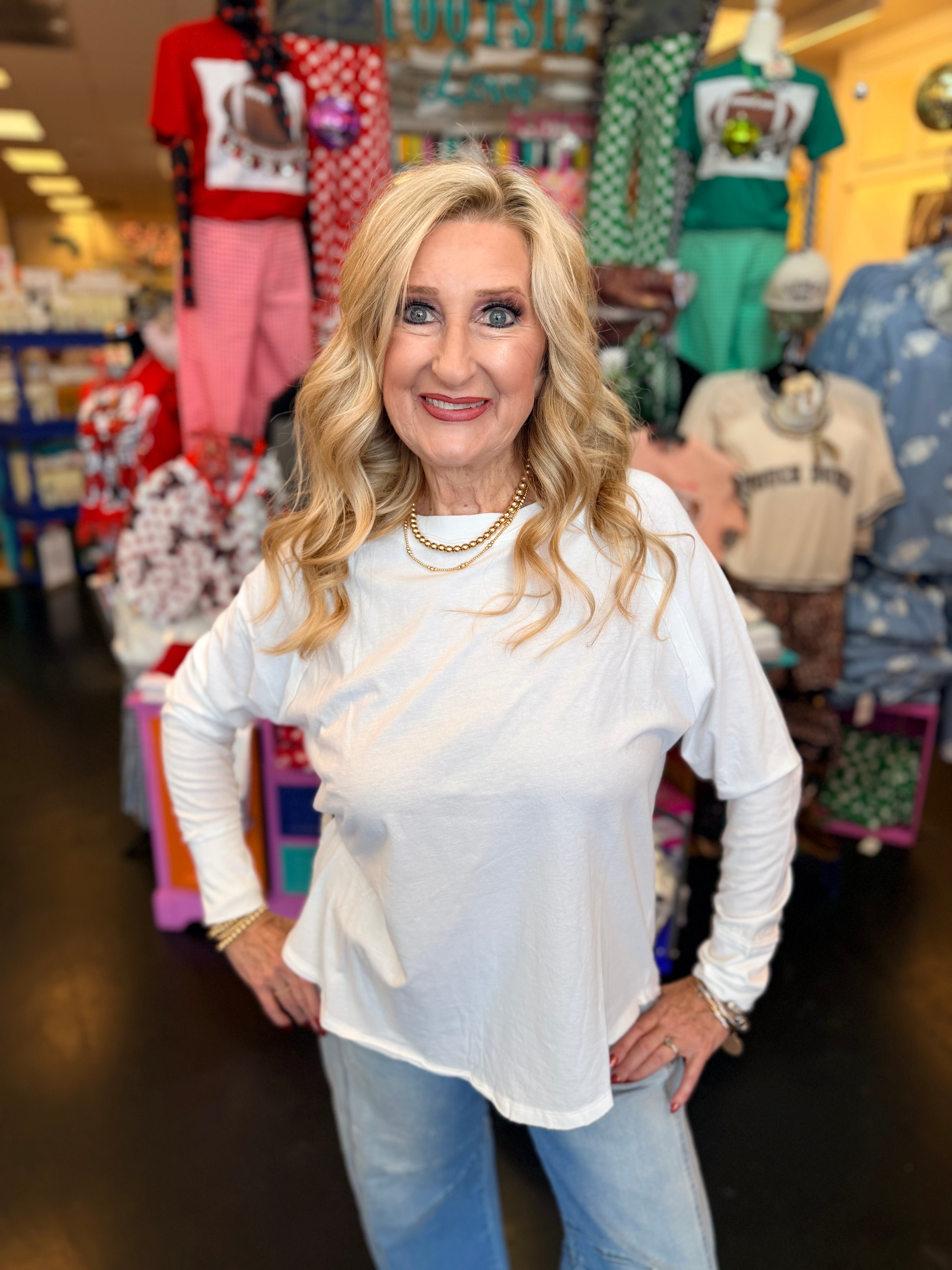 White cotton raglan top with thumbhole cuffs.