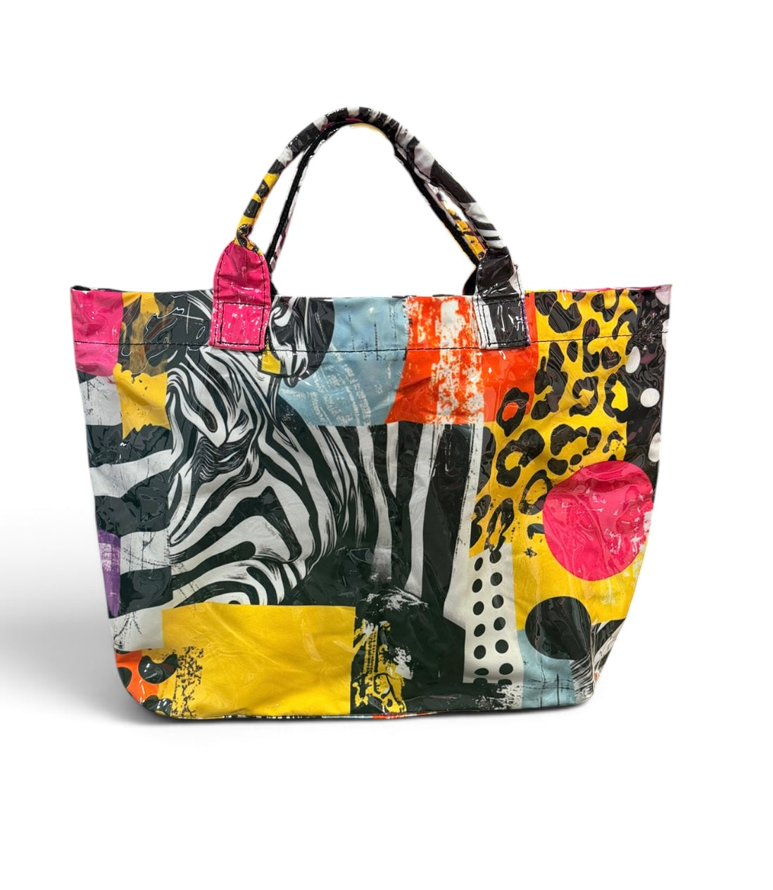 Colorful mixed-print tote bag with zebra, leopard, and polka dot designs.