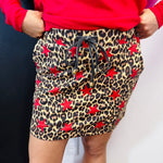 Leopard print skort with colorful stars, built-in shorts, drawstring waist, and pockets.