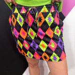 Colorful Halloween argyle skort with built-in shorts, elastic waistband and side pockets.