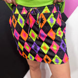 Colorful Halloween argyle skort with built-in shorts, elastic waistband and side pockets.