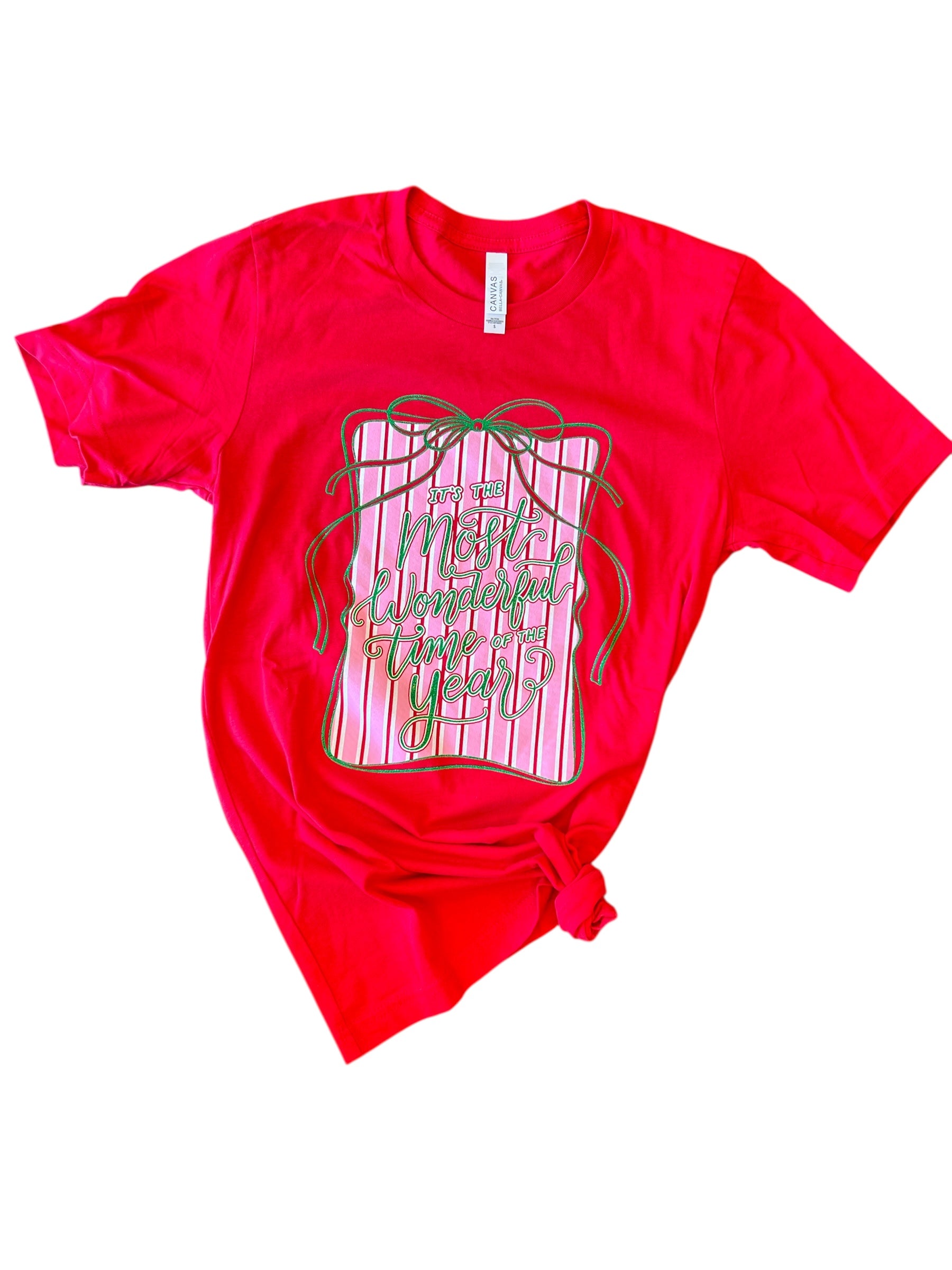 Red holiday tee with glittery “Wonderful Time of the Year” graphic, gift box, and green ribbon.