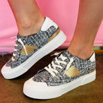 Black tweed sneakers with hidden wedge, side stripe, and memory foam insole.