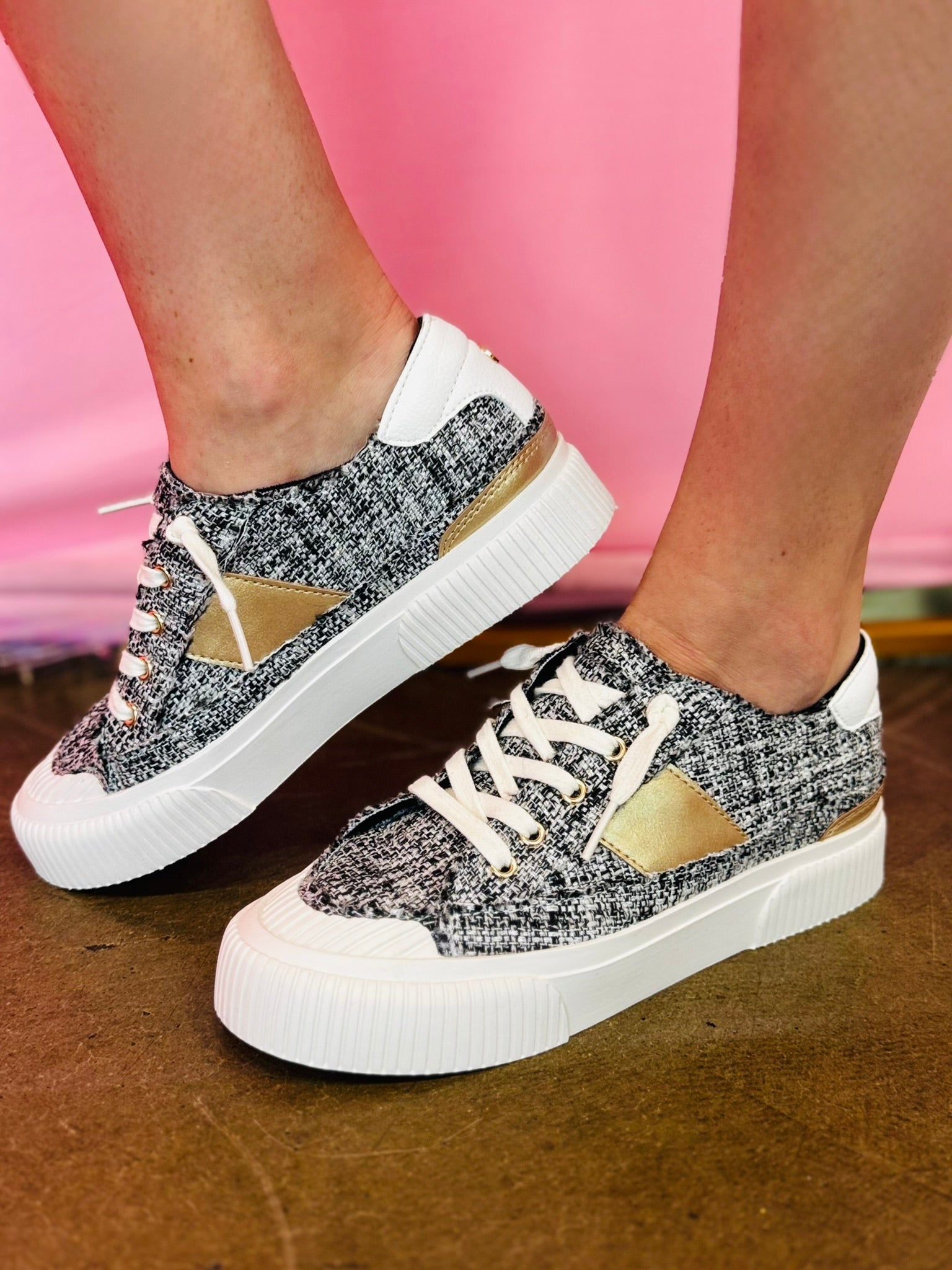 Black tweed sneakers with hidden wedge, side stripe, and memory foam insole.