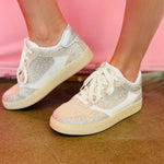 Neutral lace-up sneakers with crystal accents and cushioned removable insoles.