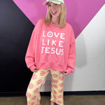 Yellow straight-leg pants covered in oversized pink polka dots.