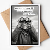 Funny birthday card with You Still Look 29 From A Distance message.