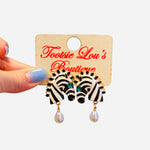 Zebra statement earrings with teal crystal eyes and pearl drop.